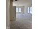 Bright living room featuring large windows that allow ample natural light into the space at 3897 Berkdale Ct, Columbus, IN 47203