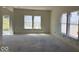 Bright, open living area with multiple large windows and natural light, perfect for entertaining at 3897 Berkdale Ct, Columbus, IN 47203