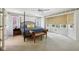 Spacious bedroom with a four-poster bed, ceiling fan, and plenty of natural light at 410 Sugar Tree Ln, Indianapolis, IN 46260