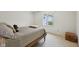 Bright bedroom featuring a comfortable bed, a window, and a warm, inviting atmosphere at 410 Sugar Tree Ln, Indianapolis, IN 46260