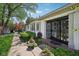 Elegant home entrance with custom ironwork door and decorative potted plants at 410 Sugar Tree Ln, Indianapolis, IN 46260