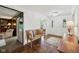 Bright foyer featuring hardwood floors, chandelier, and a charming wooden bench at 410 Sugar Tree Ln, Indianapolis, IN 46260
