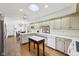 Spacious kitchen with white cabinets, stainless steel appliances, and hardwood floors at 410 Sugar Tree Ln, Indianapolis, IN 46260