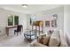 Cozy living room area with natural light, featuring a vintage desk and comfortable seating at 410 Sugar Tree Ln, Indianapolis, IN 46260