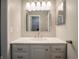 Bathroom vanity features white cabinets, a white countertop, and a modern faucet at 4268 Foxglove Trce, Indianapolis, IN 46237