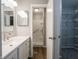 Bright bathroom featuring a vanity and a walk in shower at 4268 Foxglove Trce, Indianapolis, IN 46237