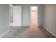 This bedroom features gray walls, carpet, and two entryways at 4268 Foxglove Trce, Indianapolis, IN 46237