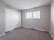 This bedroom features gray walls, carpet, and a large closet at 4268 Foxglove Trce, Indianapolis, IN 46237