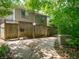 Townhome exterior featuring a private walkway, a wooden fence, and a charming front entrance at 4268 Foxglove Trce, Indianapolis, IN 46237