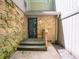 Close up showing the front door of the home with brickwork and lighting at 4268 Foxglove Trce, Indianapolis, IN 46237