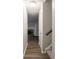 Open hallway with hardwood flooring and a view of the fireplace and stairs at 4268 Foxglove Trce, Indianapolis, IN 46237