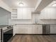 Updated kitchen with white cabinets, granite countertops, and stainless steel appliances at 4268 Foxglove Trce, Indianapolis, IN 46237