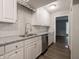 Kitchen area with stainless steel dishwasher and granite countertops at 4268 Foxglove Trce, Indianapolis, IN 46237