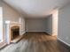 Spacious living room featuring hard wood floors and a stone fireplace at 4268 Foxglove Trce, Indianapolis, IN 46237