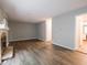 Spacious living room with fireplace, wood-look floors, and neutral paint at 4268 Foxglove Trce, Indianapolis, IN 46237