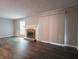 Living room displaying fireplace, hardwood floors, and ample sunlight at 4268 Foxglove Trce, Indianapolis, IN 46237