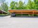 Designated carport parking area for residents, featuring multiple covered spaces for vehicle protection at 4268 Foxglove Trce, Indianapolis, IN 46237