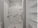 Modern walk-in shower with grab bar features both fixed and handheld shower heads at 4268 Foxglove Trce, Indianapolis, IN 46237