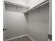Walk-in closet equipped with shelving for storage and organization at 4268 Foxglove Trce, Indianapolis, IN 46237