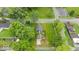 Aerial view displaying the property's layout with a separate garage and expansive green yard at 450 Pleasant St, Noblesville, IN 46060