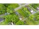 Overhead image captures the house nestled among mature trees, emphasizing its serene setting at 450 Pleasant St, Noblesville, IN 46060