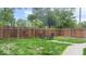 Grassy backyard featuring mature trees and a patio set at 450 Pleasant St, Noblesville, IN 46060