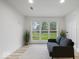 Bright finished basement space with large windows, comfortable seating, and modern flooring at 450 Pleasant St, Noblesville, IN 46060