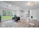 Finished basement with a comfortable seating area, bright windows, and clean white walls at 450 Pleasant St, Noblesville, IN 46060