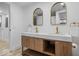 Modern bathroom featuring a double vanity, marble countertops, and gold fixtures at 450 Pleasant St, Noblesville, IN 46060