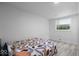 Well-lit bedroom featuring hardwood floors, a window, and neutral walls at 450 Pleasant St, Noblesville, IN 46060