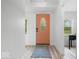 Bright foyer featuring a stylish front door with a glass insert, light walls, and modern flooring at 450 Pleasant St, Noblesville, IN 46060