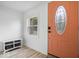Inviting foyer with a decorative front door, a convenient storage bench, and wood-look flooring at 450 Pleasant St, Noblesville, IN 46060