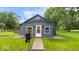 Charming single-story home with neat landscaping, a new roof, and a welcoming front door at 450 Pleasant St, Noblesville, IN 46060