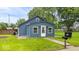Cozy one-story home with fresh exterior paint, new windows, and a well-manicured lawn at 450 Pleasant St, Noblesville, IN 46060