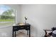 Home office featuring a writing desk with drawers, chair, and a view from the window at 450 Pleasant St, Noblesville, IN 46060