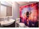 Bathroom featuring a colorful outer space shower curtain and vintage sink at 4625 N Sadlier Dr, Indianapolis, IN 46226