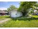 Detached one-car garage with gravel driveway and tree at 4625 N Sadlier Dr, Indianapolis, IN 46226