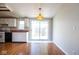 Eat-in kitchen with a vintage light fixture and ample natural light at 4625 N Sadlier Dr, Indianapolis, IN 46226