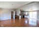 Open-concept living area with wood-look floors flowing into kitchen at 4625 N Sadlier Dr, Indianapolis, IN 46226