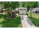 Picturesque aerial view of a well-maintained home with a two-car garage, beautiful landscaping, and mature trees at 469 Ash Dr, Carmel, IN 46032