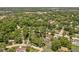 An aerial view displays a neighborhood with dense trees and well-spaced homes, creating a sense of privacy at 469 Ash Dr, Carmel, IN 46032