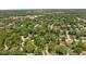 An aerial shot of a neighborhood reveals tree-lined streets and diverse homes, blending residential comfort with accessibility at 469 Ash Dr, Carmel, IN 46032