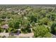 An aerial view of a quaint neighborhood with mature trees and well-maintained homes on a sunny day at 469 Ash Dr, Carmel, IN 46032