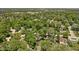 Expansive aerial view of the neighborhood with lush green trees and well-maintained homes at 469 Ash Dr, Carmel, IN 46032