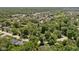 Lush trees surround a residential neighborhood in this aerial shot, showcasing the community and nearby roadways at 469 Ash Dr, Carmel, IN 46032