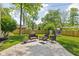 Green backyard featuring a relaxing patio area, seating and a wooden fence at 469 Ash Dr, Carmel, IN 46032