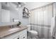 Bright bathroom with granite countertop, classic white toilet, and decor at 469 Ash Dr, Carmel, IN 46032