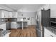 Well-lit kitchen with stainless steel appliances, granite countertops, and ample storage space at 469 Ash Dr, Carmel, IN 46032