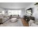 Inviting living room features neutral tones, plush seating, and a large window for ample natural light at 469 Ash Dr, Carmel, IN 46032