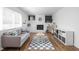 Cozy living room with a white brick fireplace, modern decor, and a comfortable seating arrangement for relaxing evenings at 469 Ash Dr, Carmel, IN 46032